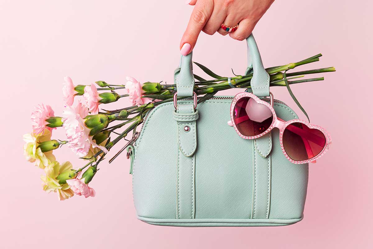 fashion-product-reviews styled handbag product with bouquet of flowers