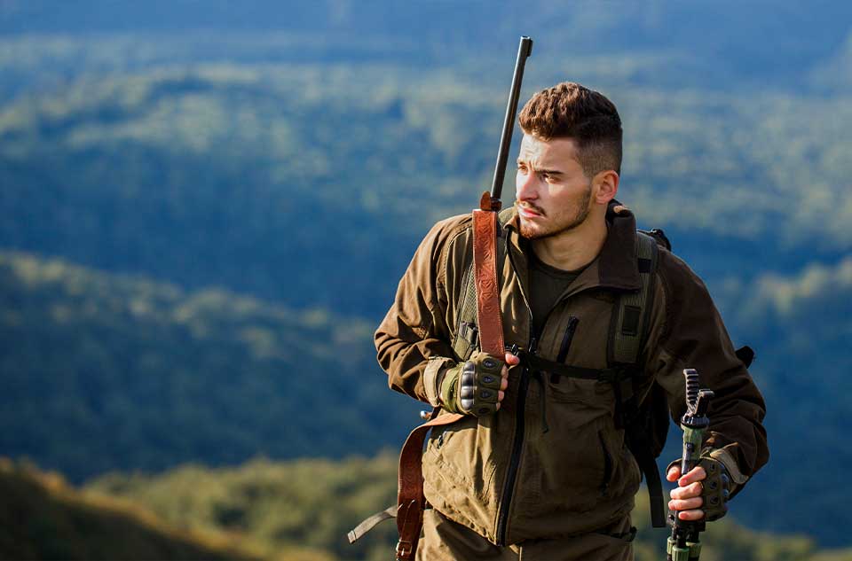 hiking-with-gear man walking through mountains