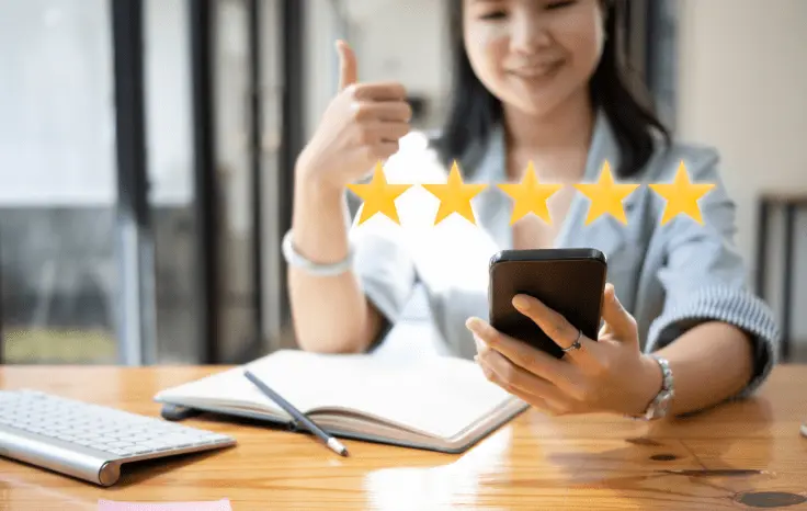 collect-reviews Looking at a 5-star review on phone
